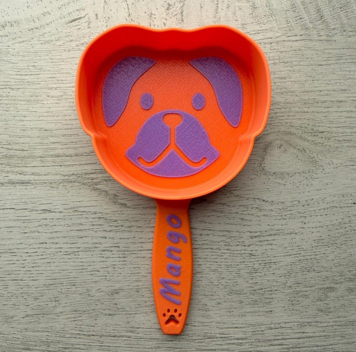 3D printed dog food scoop with a custom pet name, in a two-color finish
