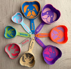 Puppy-face dog food scoop shown with kibble, printed in a custom color