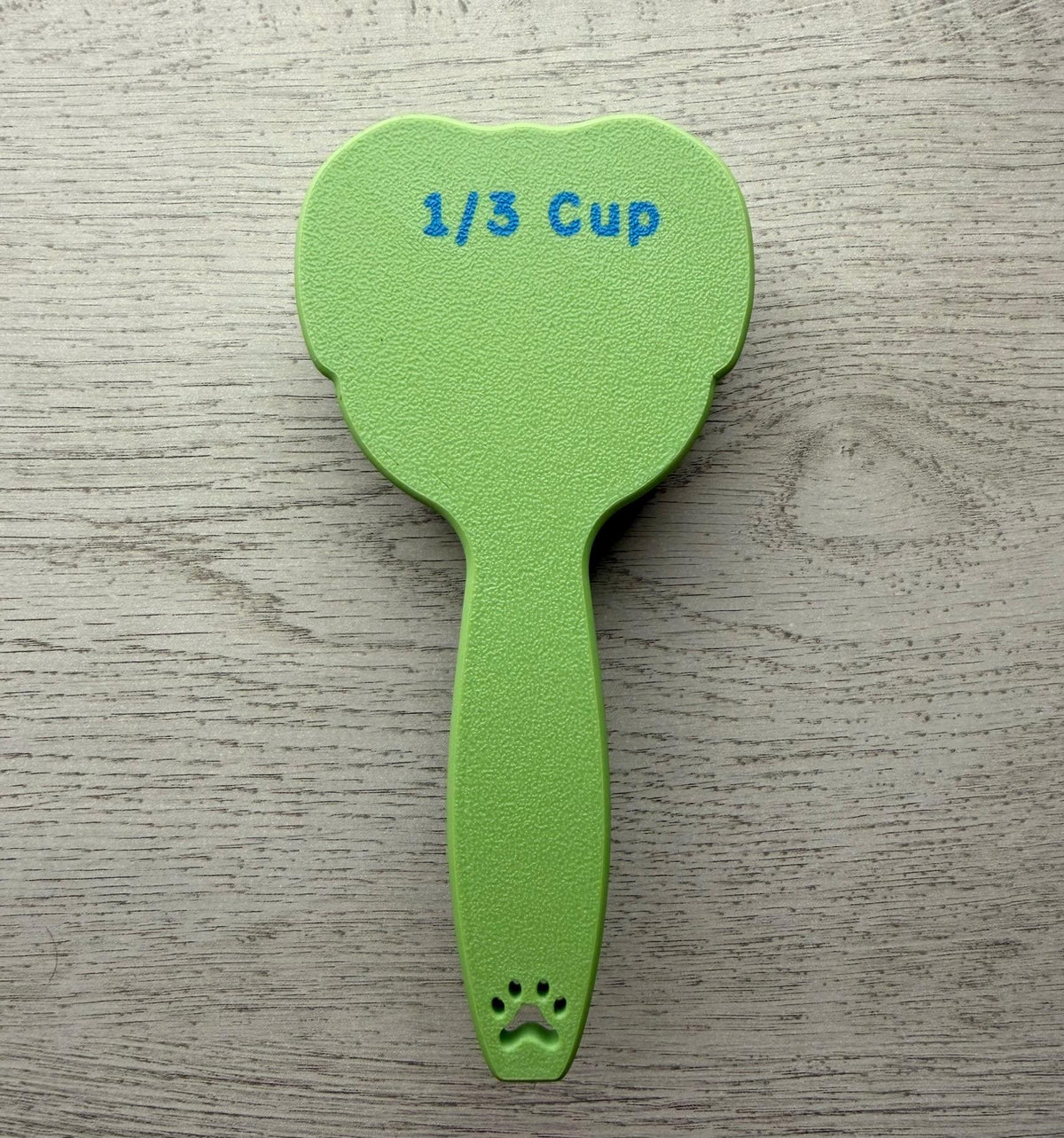 3D printed dog food scoop with a custom pet name, in a two-color finish