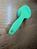 Green personalized dog food scoop showing the paw print on the handle