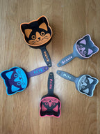 Cat-face shaped kibble scoop printed in two colors with a custom name
