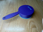 Blue dog food scoop showing the 3/4 cup size marking