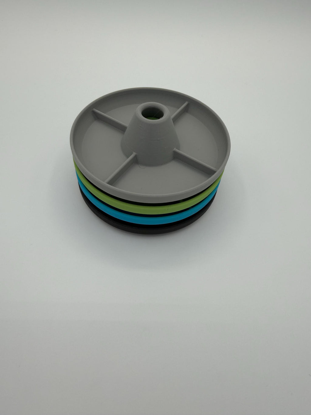 Tumbler drying rack holding a cup upside down to drain