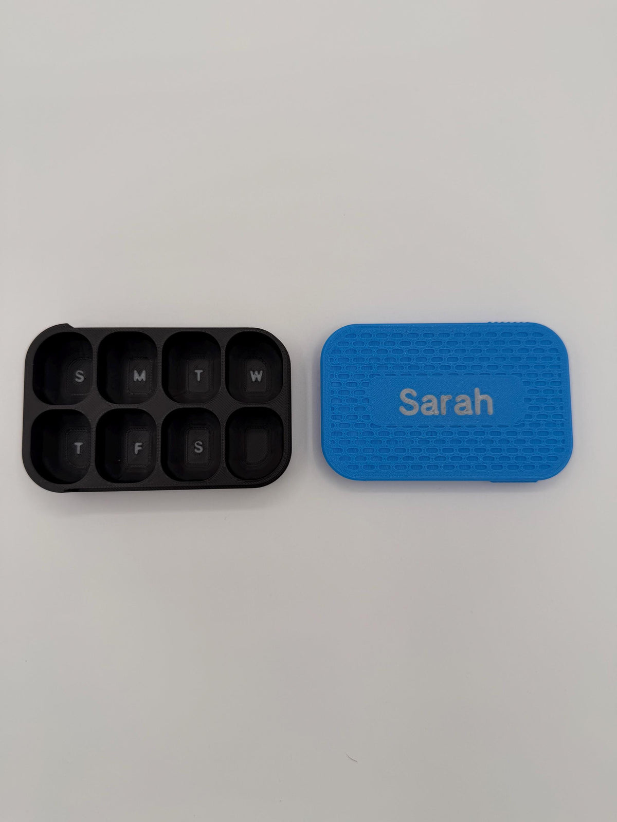 3D printed pill box with a custom name, in a two-color finish
