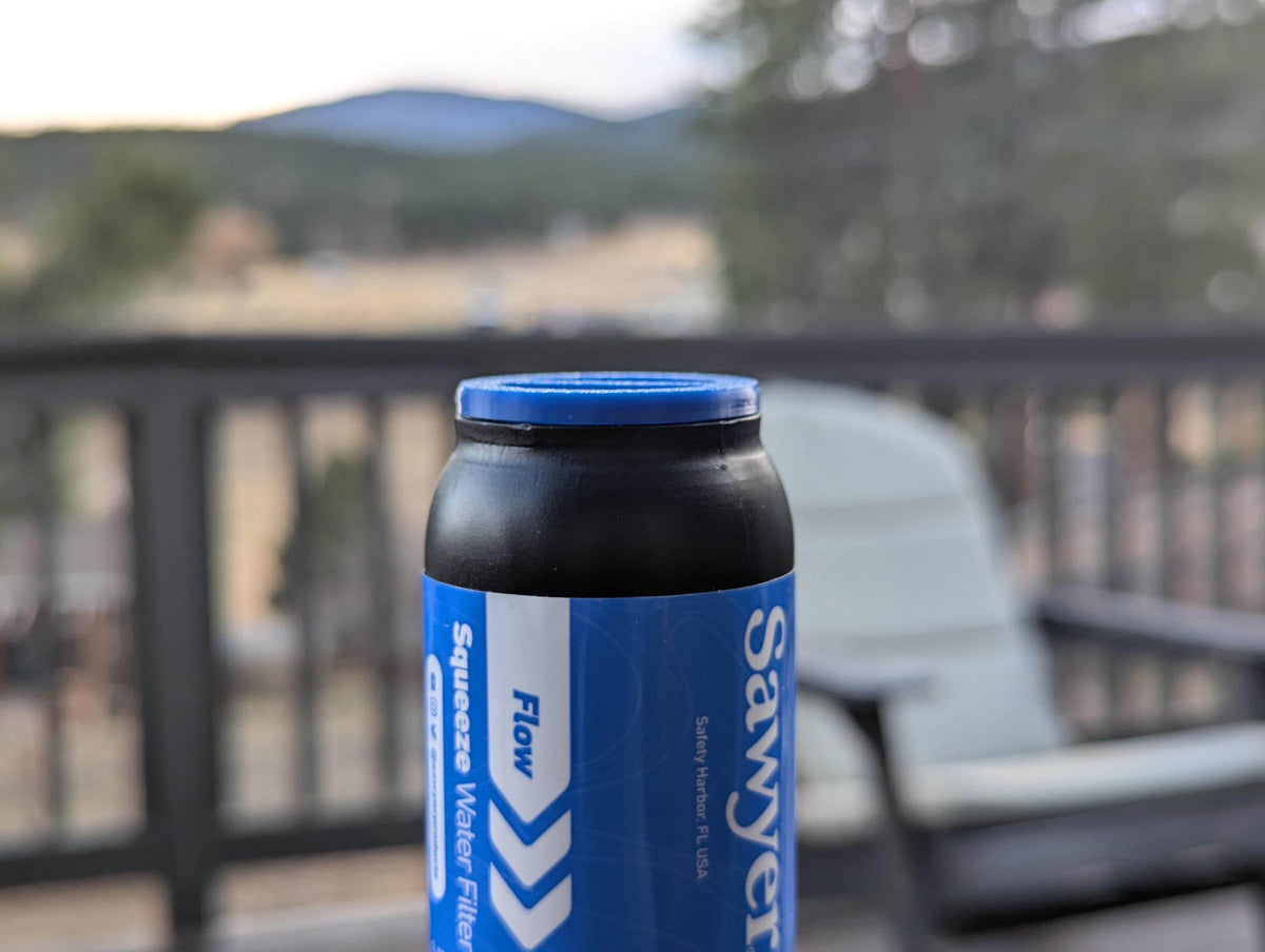 Ultralight Sawyer Squeeze cap shown on a bottle outdoors