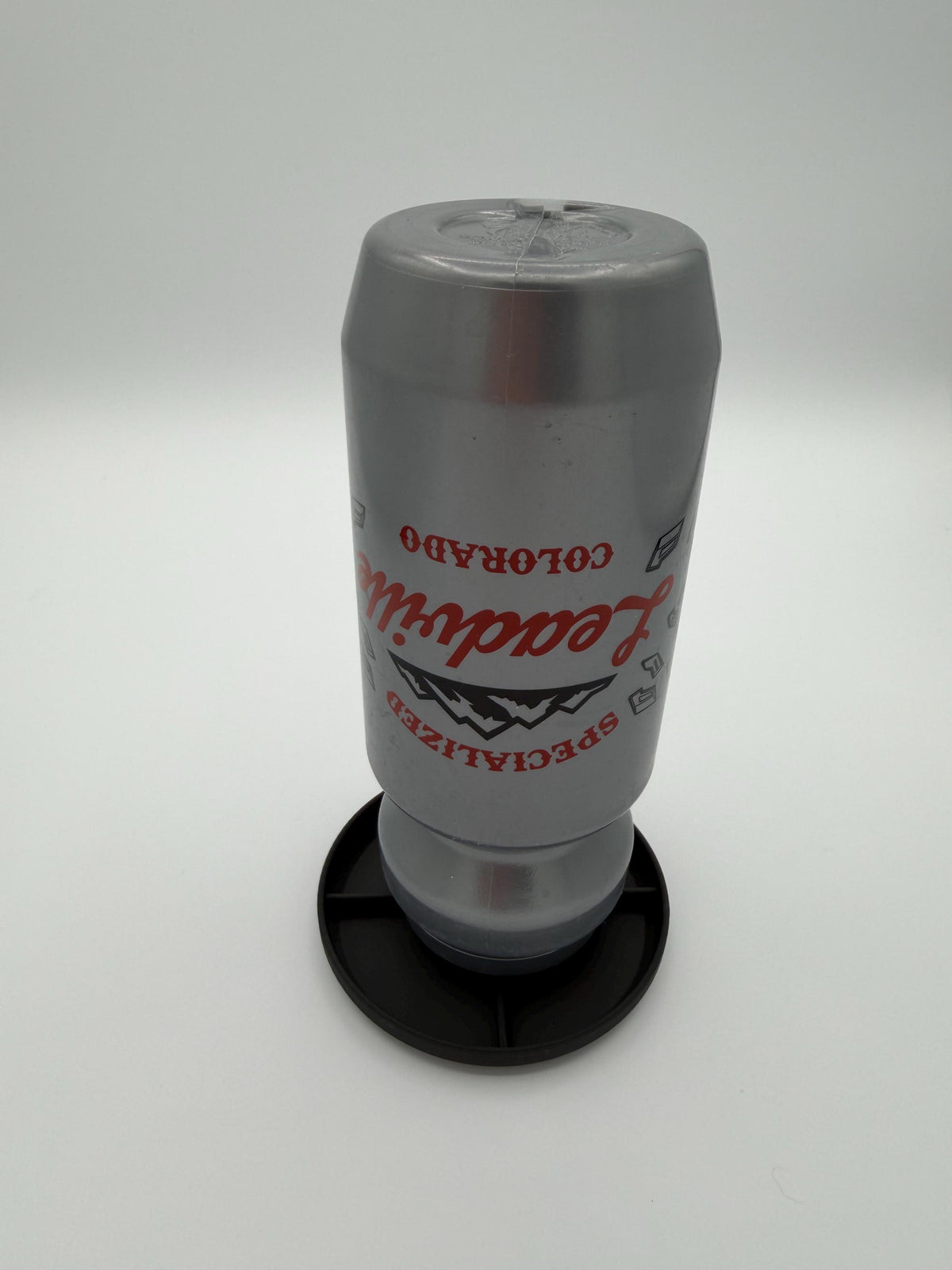 Tumbler drying rack holding a cup upside down to drain