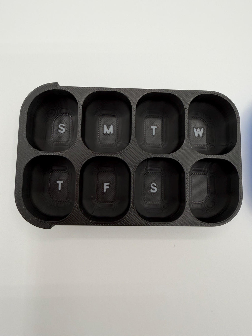 3D printed pill box with a custom name, in a two-color finish