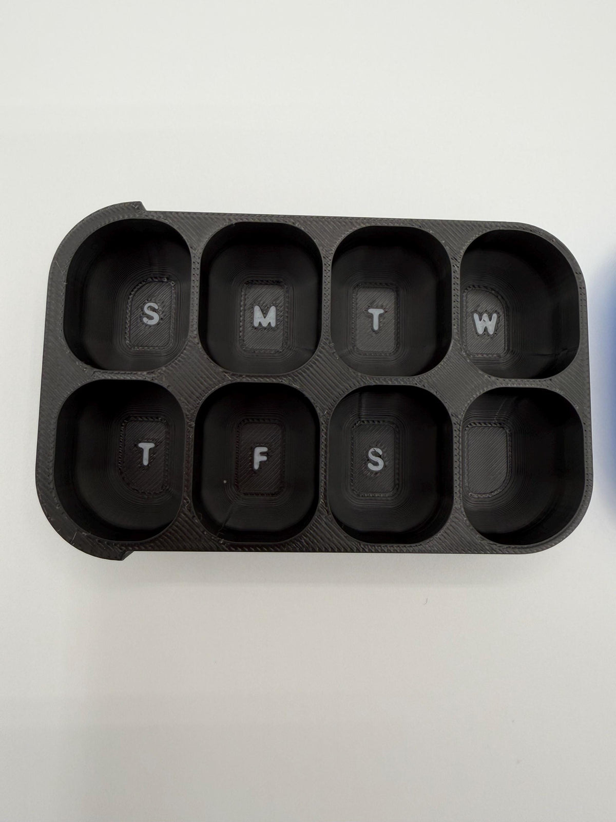 3D printed pill box with a custom name, in a two-color finish