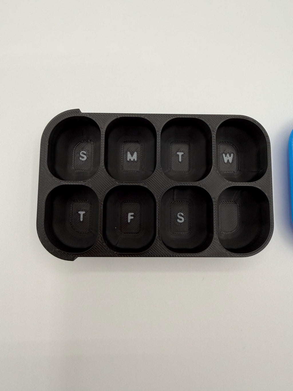 3D printed pill box with a custom name, in a two-color finish
