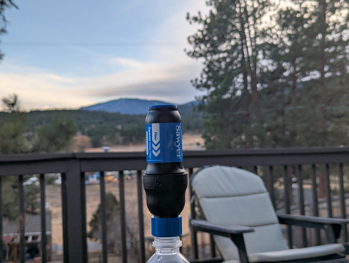 Ultralight Sawyer Squeeze cap shown on a bottle outdoors