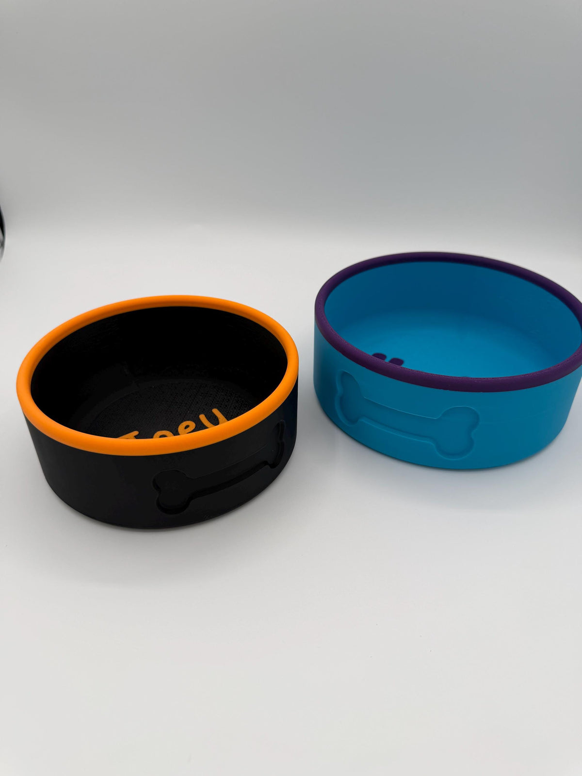 Personalized pet bowl showing the raised custom name around the edge