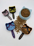 Personalized cat food scoop with a cat-face shaped cup and a custom name on the handle