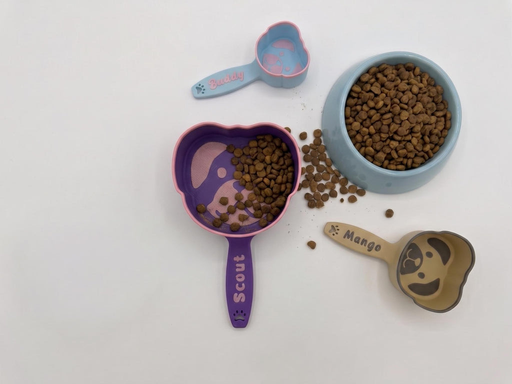 3D printed dog food scoop with a custom pet name, in a two-color finish