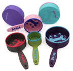 Group of personalized dog food scoops with names including Annie and Daisy, in assorted colors